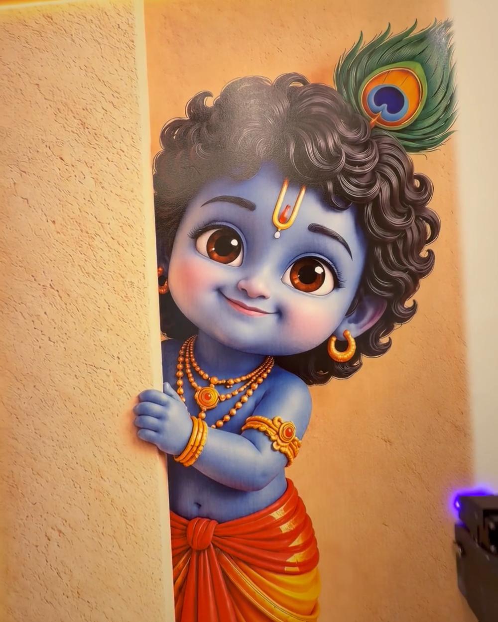 A Krishna mural printed on a wall by WallBliss, with the printer beside it